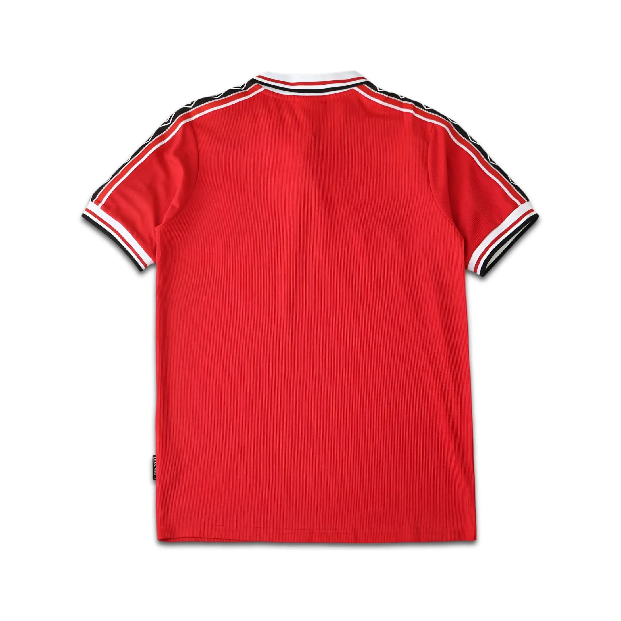 Red Manchester United jersey.