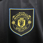 Manchester United logo on a black background