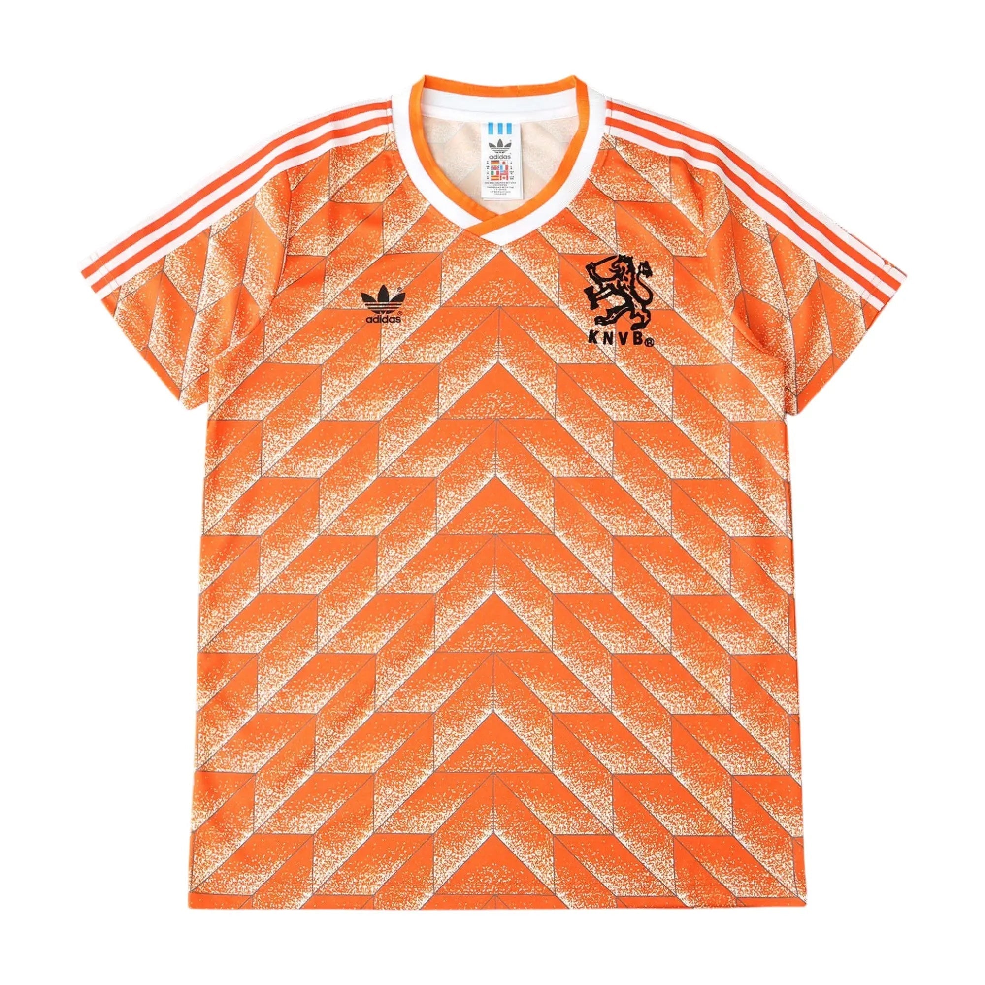 Orange and white Adidas Netherlands soccer jersey with a geometric pattern, featuring the Adidas logo and the lion crest with 'NEDERLAND' on the chest.
