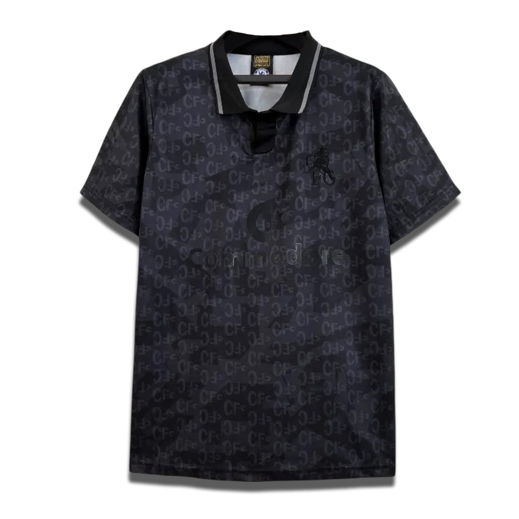A black Chelsea FC retro away shirt from the 1990/91 season with a subtle pattern and collar.