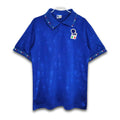 A blue soccer jersey featuring the Italy national team's design with a subtle pattern and a retro Diadora collar.
