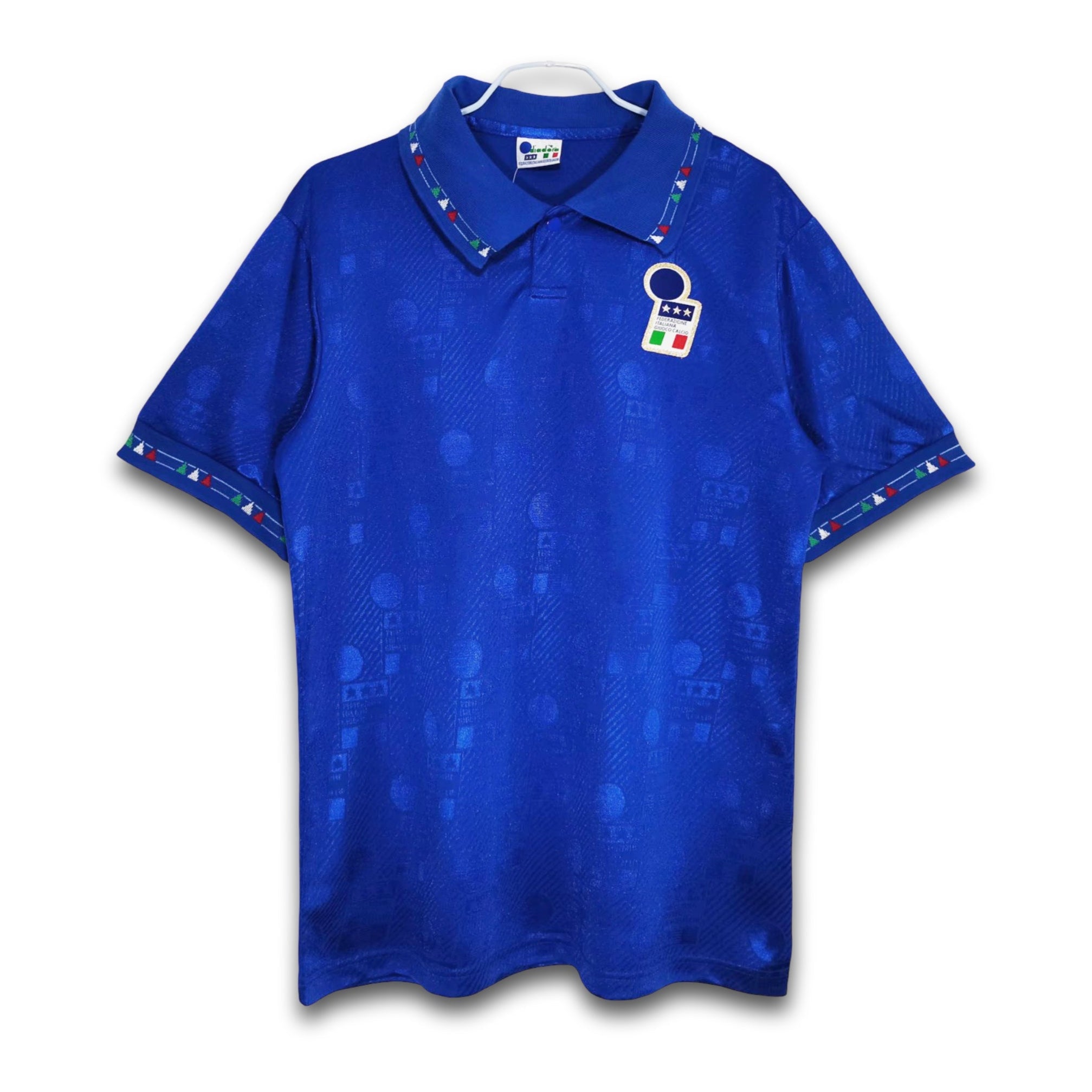 A blue soccer jersey featuring the Italy national team's design with a subtle pattern and a retro Diadora collar.