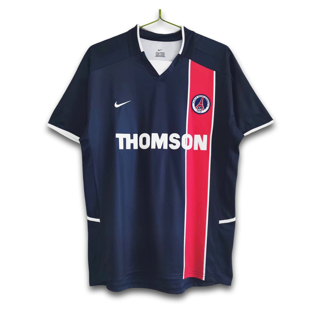 A soccer jersey with a central red stripe flanked by dark navy and white accents, featuring the Opel sponsor logo and the Nike swoosh.