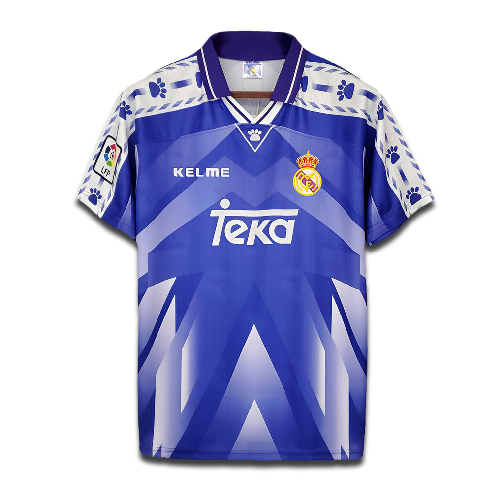 A deep blue Real Madrid 1996/97 away football shirt with Teka sponsor logo and Kelme paw-print trim.