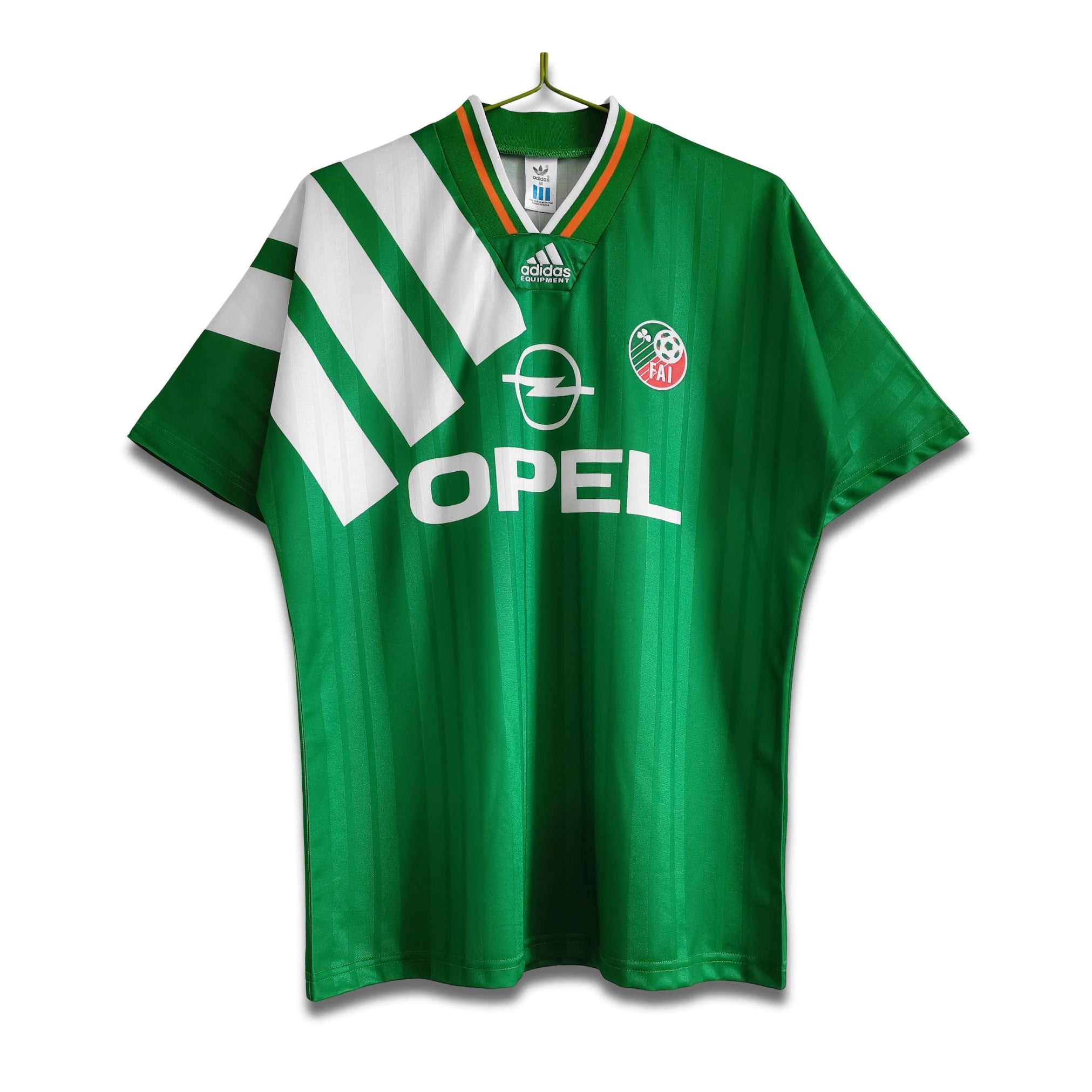 A 1995 Republic of Ireland home football shirt with a green base, white and orange chest stripes, and the Adidas trefoil logo.