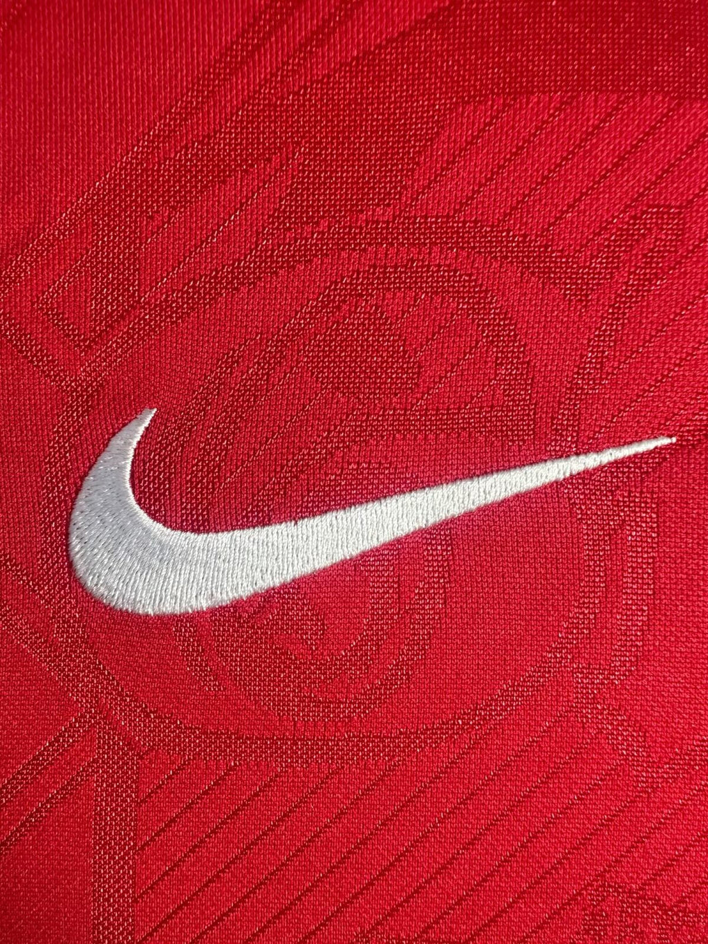 Red fabric with a white Nike logo