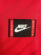 Close-up of a Nike label on a red background