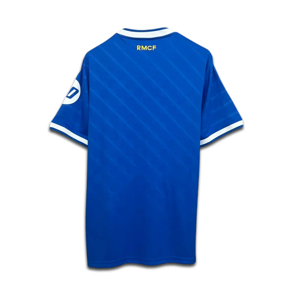 Blue Real Madrid jersey with 'RMCF' branding on a white background