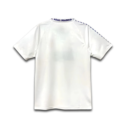White sports jersey with 'Real Madrid' branding on a white background