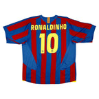 Back view of a FC Barcelona Ronaldinho number 10 soccer jersey with blue and red vertical stripes, yellow lettering, and a white background.