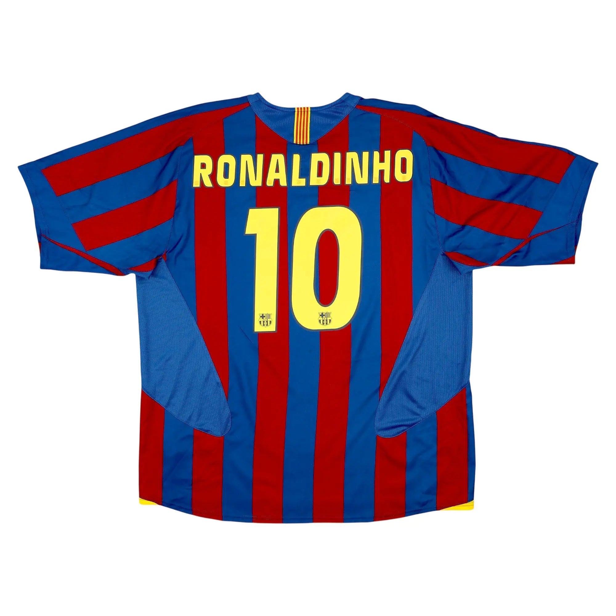 Back view of a FC Barcelona Ronaldinho number 10 soccer jersey with blue and red vertical stripes, yellow lettering, and a white background.