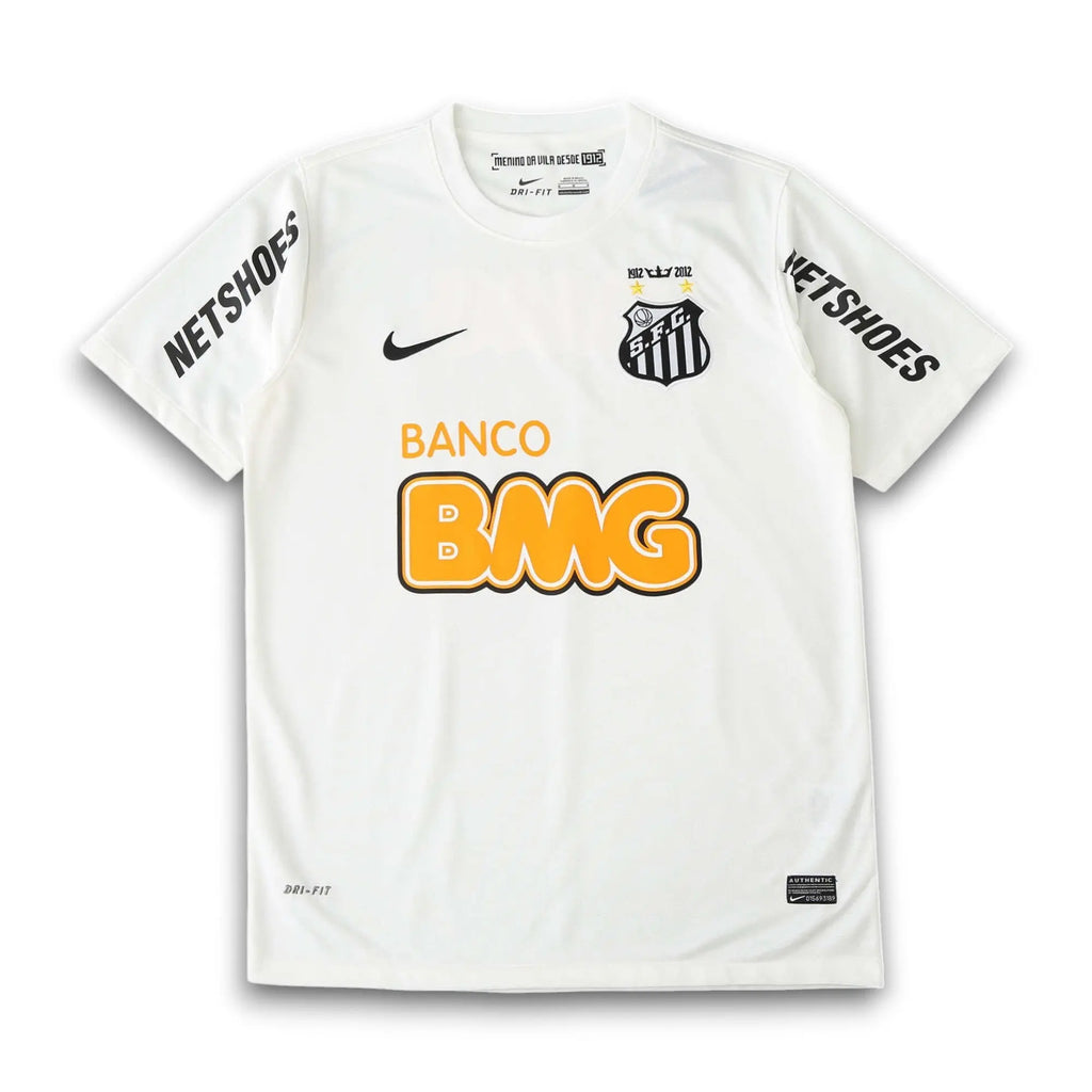 A white Nike Santos FC soccer jersey with black and yellow accents, featuring the 'Netshoes' sponsor logo on the sleeves, 'Banco BMG' on the front, and the club crest on the chest.