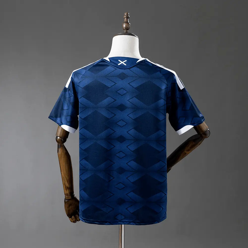Blue sports jersey on a mannequin against a gray background
