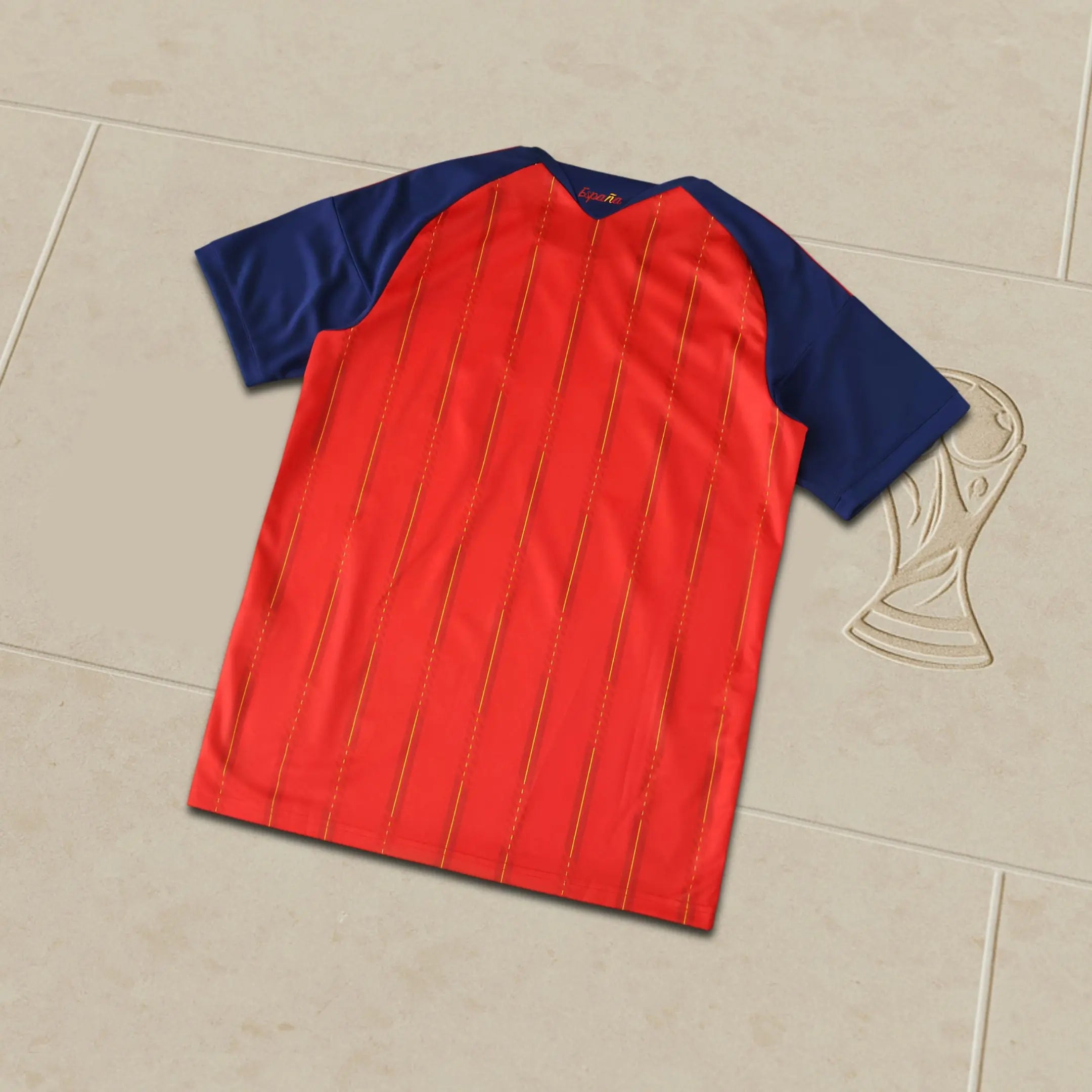 Red and blue sports jersey on a beige tiled floor
