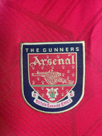 Arsenal FC logo on a red background