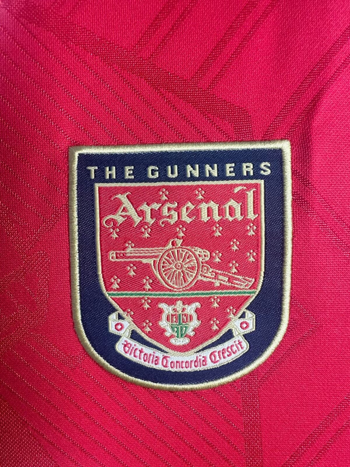 Arsenal FC logo on a red background