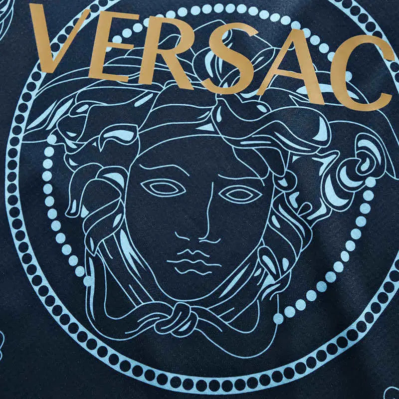 Versace logo with Medusa head design on a dark background